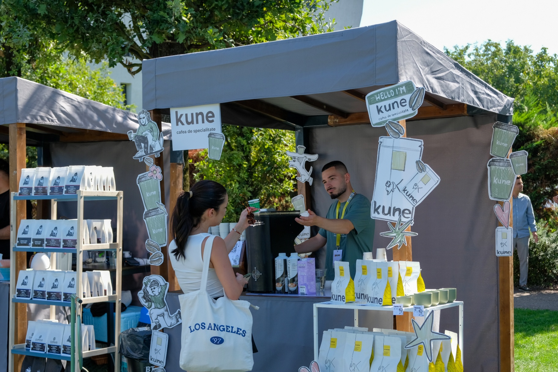 Coffee stand with festival branding and packaged beans
