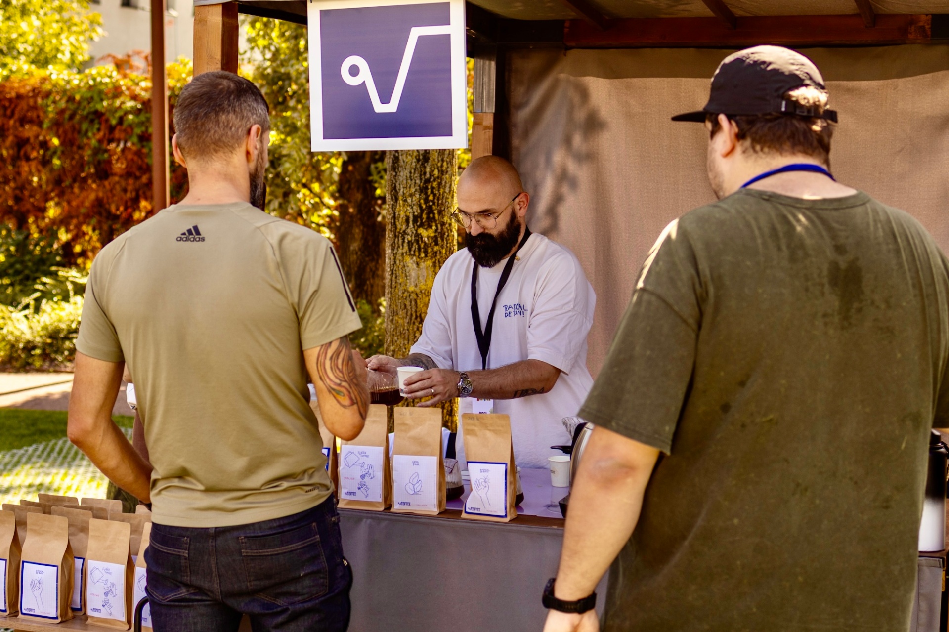 Roaster serving coffee tastings at the festival